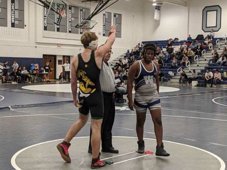 Under new VHSL guidelines, the referee will no longer raise the winner's hand after a wrestling match. 