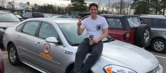 Behind the Wheel Instructor Brian Booth sits on the county training car. (Photo taken in 2019)