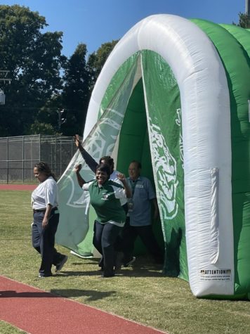 Four custodians come through the football entry.