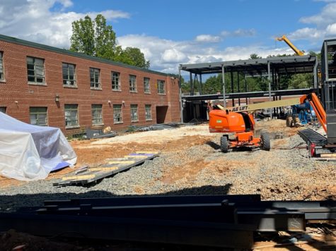 A new courtyard looking toward the skeleton of the new library.