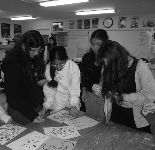 Students make bracelets at a bracelet-making station during the most recent FC wellness day.
