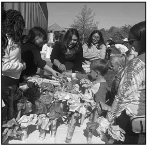 Natalie Mejia-Ramos (10), Cindy De Leon-De Leon (10), and Fiorela Singueza-Morales (11) volunteering at Earth Day Extravaganza. (Photo courtesy of Gaby Henriquez)