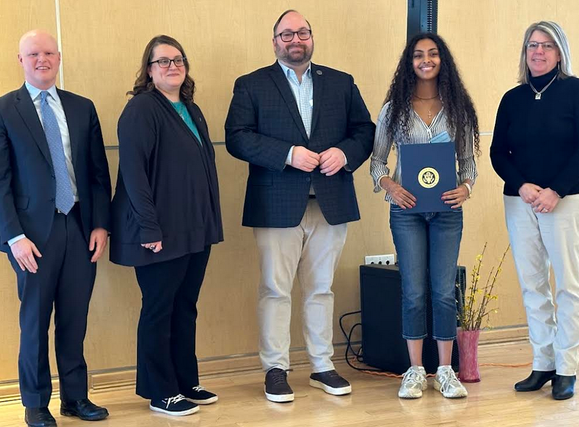Hlena Hailemariam was presented with the Fairfax Peace Award by school board members Ryan McElveen, Sandy Anderson, Karl Frisch, and Robyn Lady. (Photo courtesy of Fairfax Peace Awards)