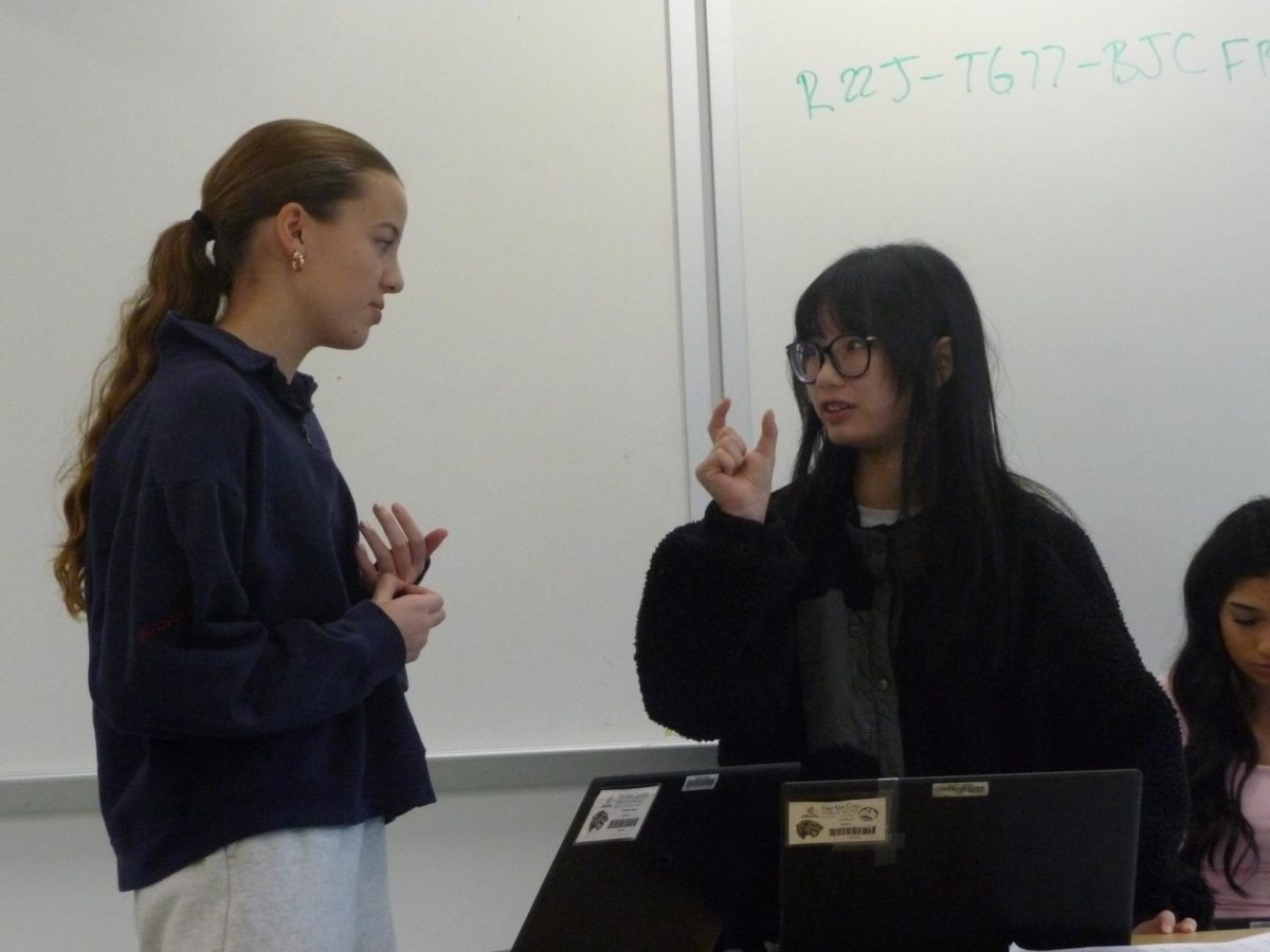 Charlotte Hayes (10) and Nin Nguyen (10) practice debating skills. FC is re-staring both speech and debate as VHSL team sports this year.