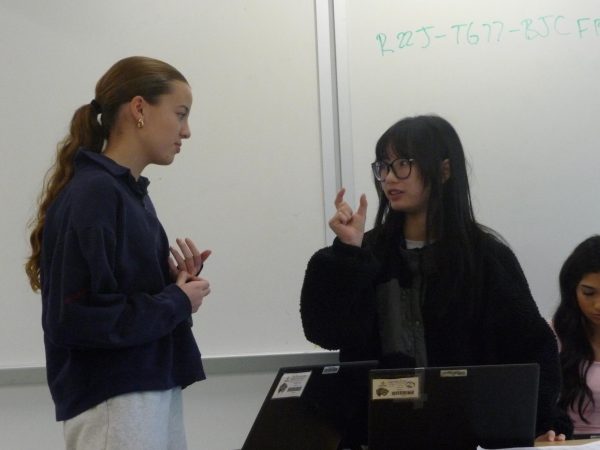 Charlotte Hayes (10) and Nin Nguyen (10) practice debating skills. FC is re-staring both speech and debate as VHSL team sports this year.