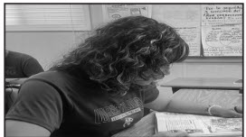 Damaris Buruca-Escobar (11) shows off her curly hair.